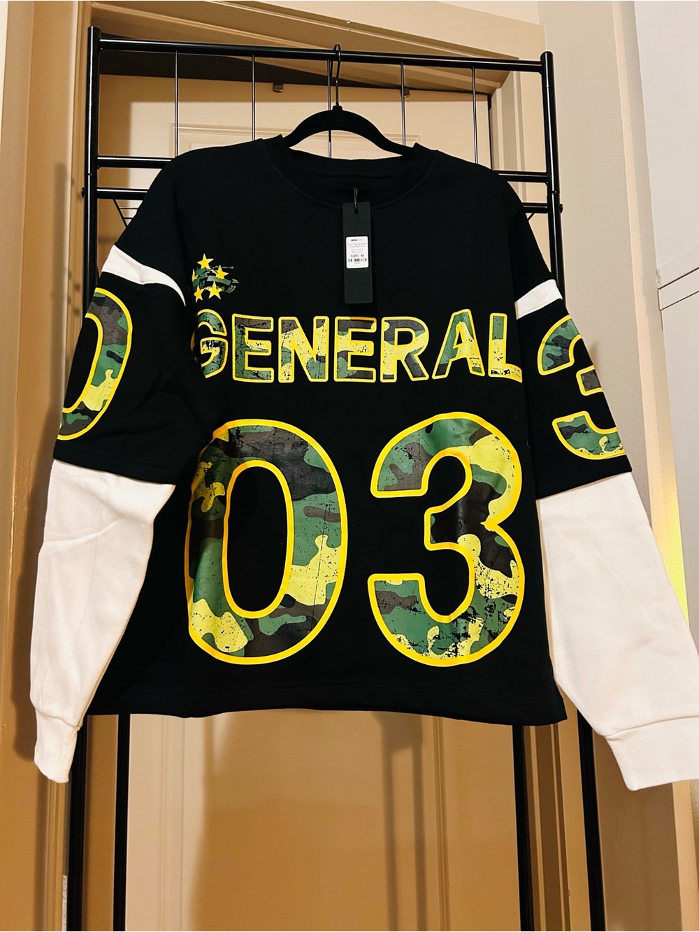 Black Crewneck Sweatshirt with White Sleeves and Yellow-Outlined Camo Graphics